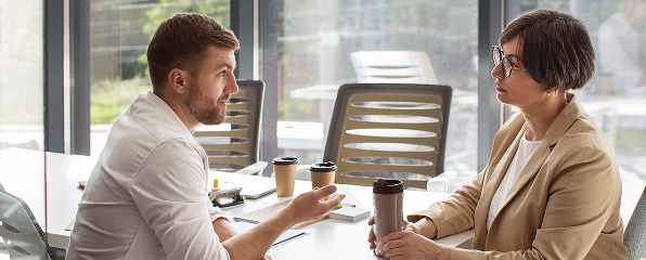 A workplace conversation with two professional leaders