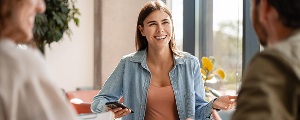 A friendly woman talking with her peers